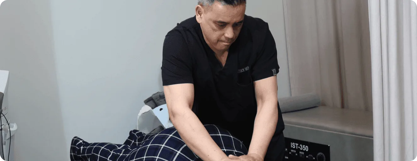 Dr. Patrick Nierva with patient